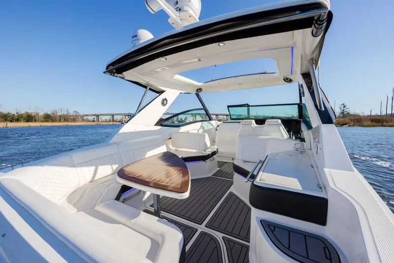  Yacht Photos Pics 2019 Sea Ray 320 Sundancer OB luxury boat interior on a sunny day.