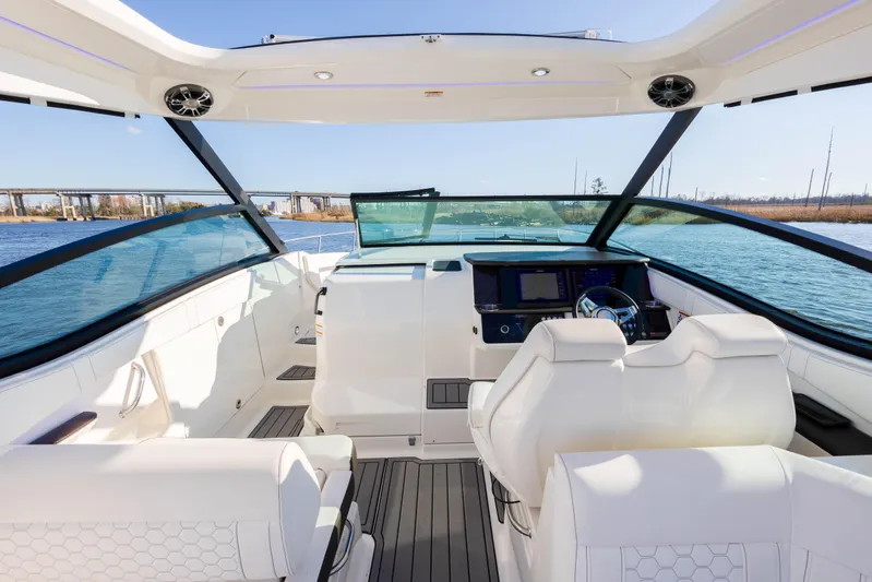  Yacht Photos Pics 2019 Sea Ray 320 Sundancer OB cockpit with modern helm and white seating.