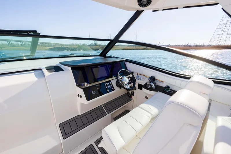  Yacht Photos Pics 2019 Sea Ray 320 Sundancer OB helm with modern controls and waterfront view.