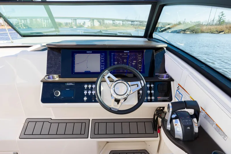  Yacht Photos Pics 2019 Sea Ray 320 Sundancer OB helm with modern controls and navigation screens.
