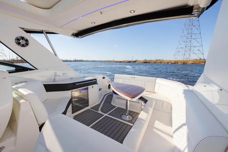  Yacht Photos Pics 2019 Sea Ray 320 Sundancer OB interior with luxurious seating and scenic water view.