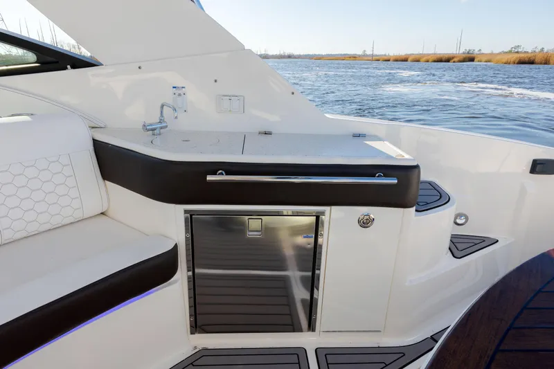  Yacht Photos Pics 2019 Sea Ray 320 Sundancer OB yacht interior with kitchenette and water view.