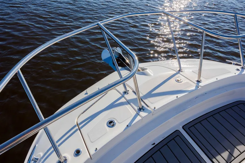  Yacht Photos Pics 2019 Sea Ray 320 Sundancer OB bow with stainless steel railings on water.