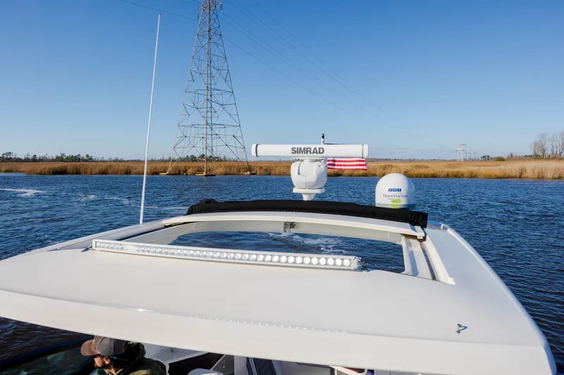  Yacht Photos Pics 2019 Sea Ray 320 Sundancer OB on a calm river with clear blue sky.