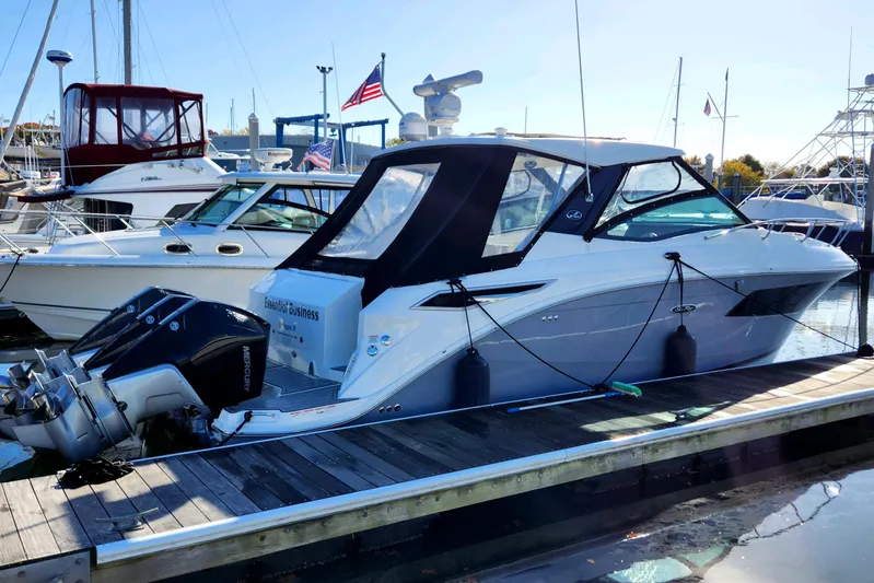  Yacht Photos Pics 2019 Sea Ray 320 Sundancer OB docked at a marina.
