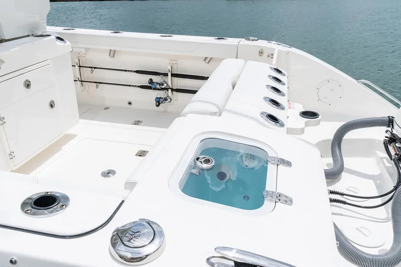  Yacht Photos Pics Manufacturer Provided Image: 2025 Pursuit S 268 Sport boat interior with fishing rod holders and livewell.