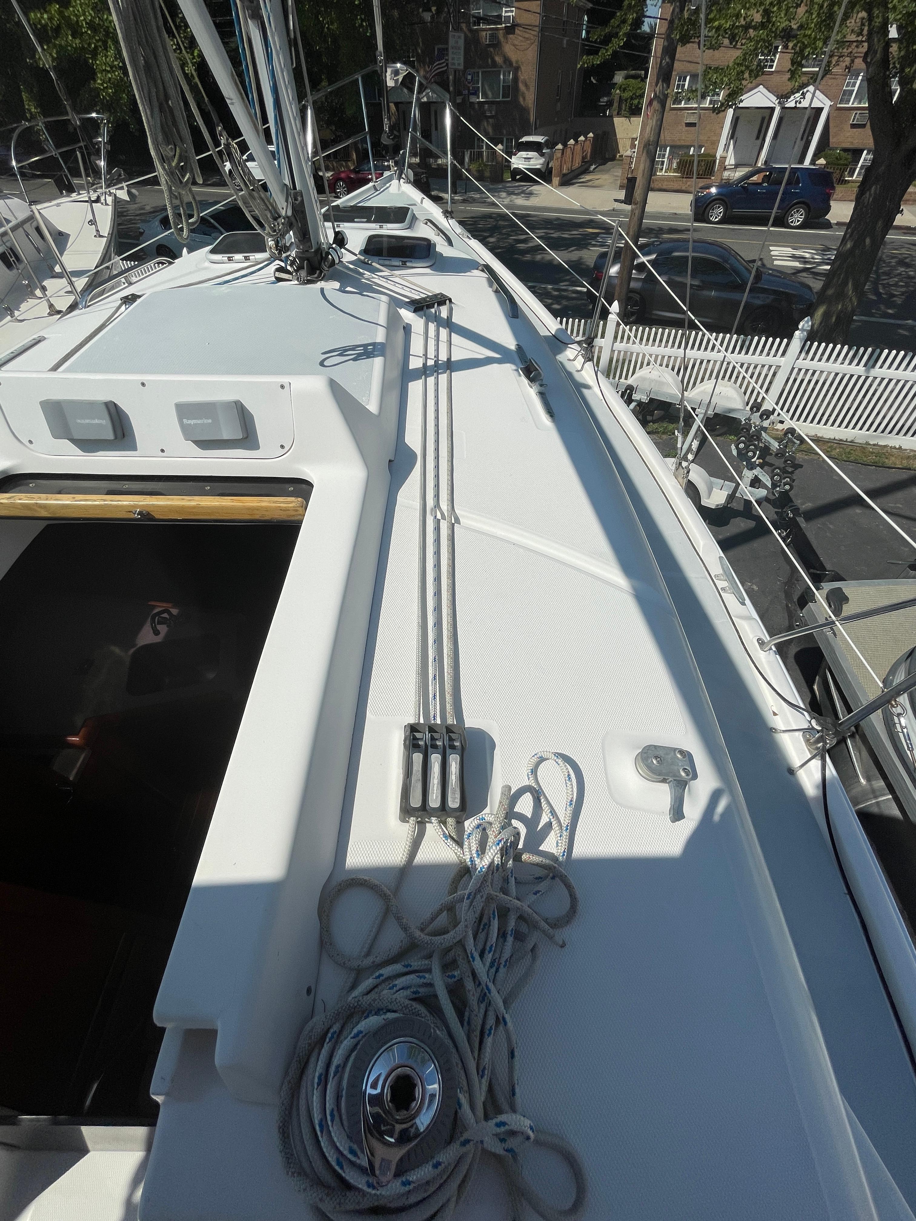 Deck of 2001 Hunter 306 sailboat with rigging and ropes.