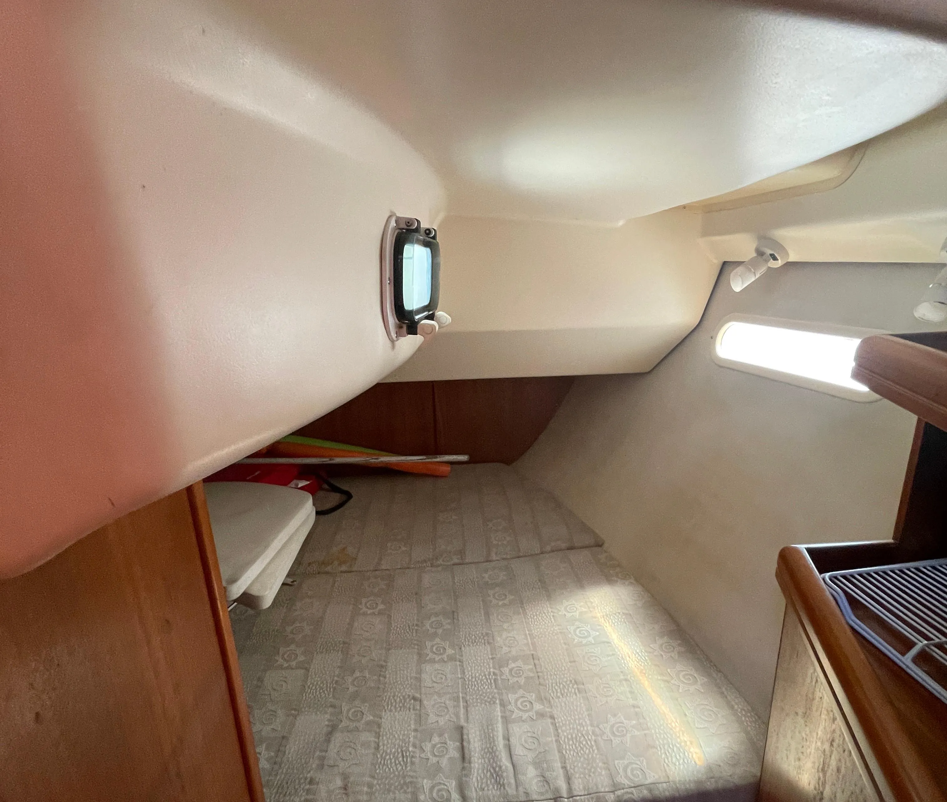 Interior cabin of a 2001 Hunter 306 sailboat with a cozy sleeping area.