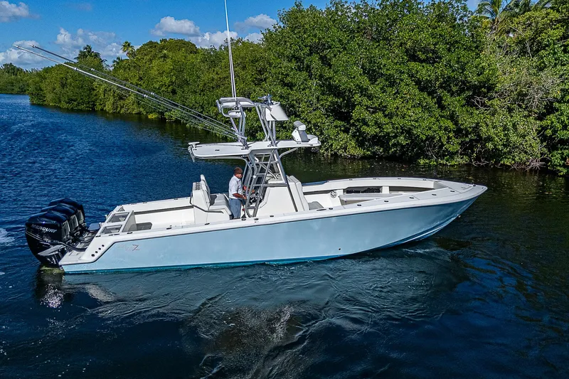  Yacht Photos Pics 2018 SeaVee 370z boat cruising on a scenic waterway.