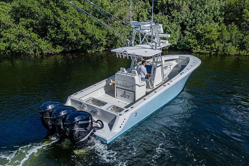  Yacht Photos Pics 2018 SeaVee 370z boat cruising on a river with triple Mercury engines.