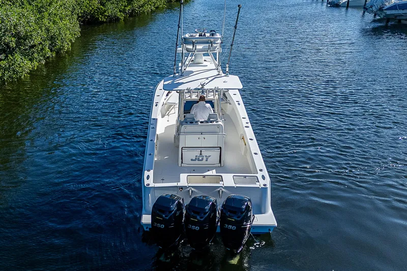 Yacht Photos Pics 2018 SeaVee 370z boat with triple engines cruising on a calm waterway.