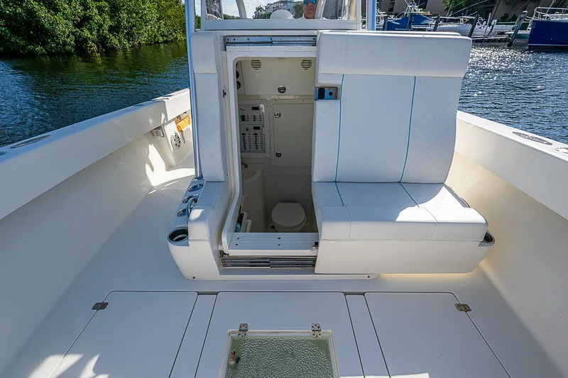  Yacht Photos Pics 2018 SeaVee 370z boat interior with open cabin door, white seating, and water view.