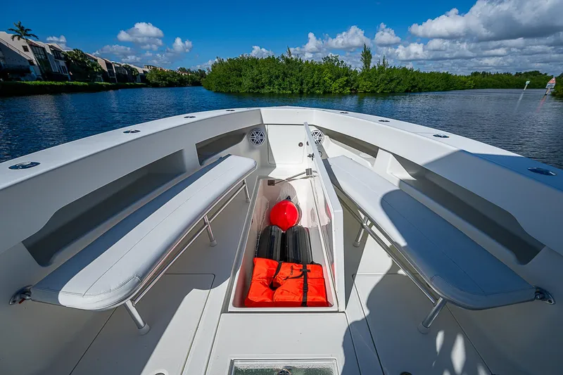  Yacht Photos Pics 2018 SeaVee 370z boat interior with seating and storage, on a sunny day.