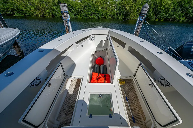  Yacht Photos Pics 2018 SeaVee 370z boat interior with open storage compartments and safety gear.