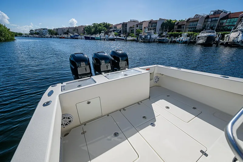  Yacht Photos Pics 2018 SeaVee 370z boat with triple engines docked in a scenic marina.