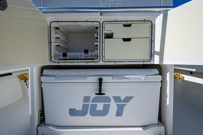  Yacht Photos Pics 2018 SeaVee 370z boat storage compartments with cooler labeled "JOY."