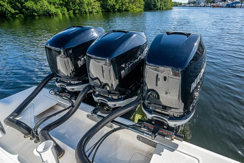 Yacht Photos Pics 2018 SeaVee 370z boat with triple Mercury outboard engines on a calm waterway.