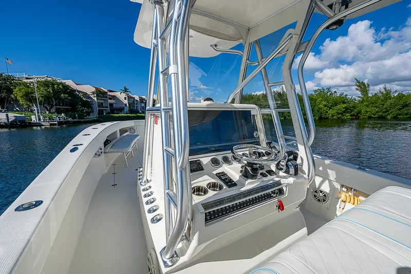  Yacht Photos Pics 2018 SeaVee 370z boat console with modern controls on a sunny day.