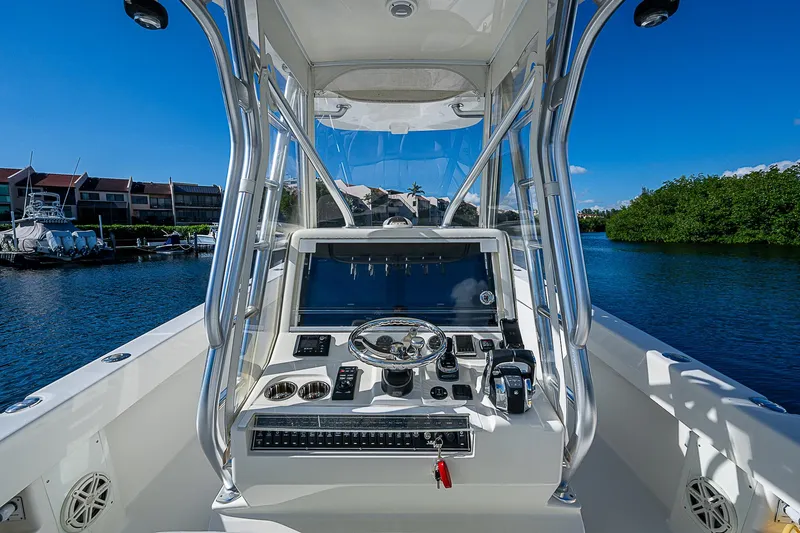  Yacht Photos Pics 2018 SeaVee 370z boat console with navigation equipment on a sunny day.