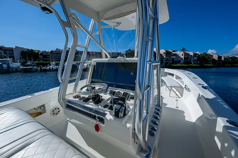  Yacht Photos Pics 2018 SeaVee 370z boat cockpit with modern controls and waterfront view.
