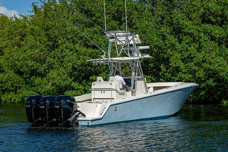  Yacht Photos Pics 2018 SeaVee 370z boat with triple engines on a calm waterway.