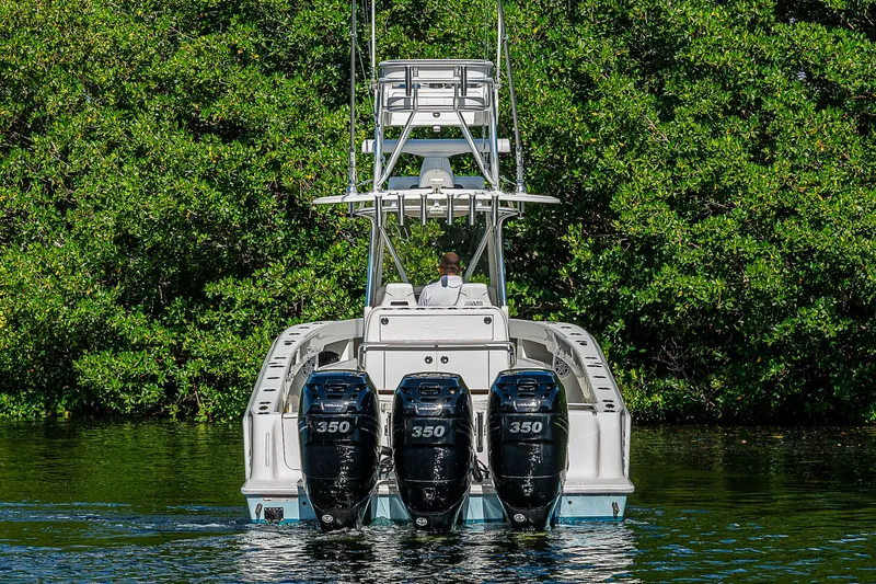  Yacht Photos Pics 2018 SeaVee 340Z boat with triple 350 horsepower engines on a calm waterway.
