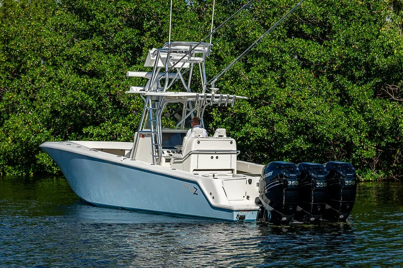  Yacht Photos Pics 2018 SeaVee 340Z boat with triple Mercury engines on a calm waterway.