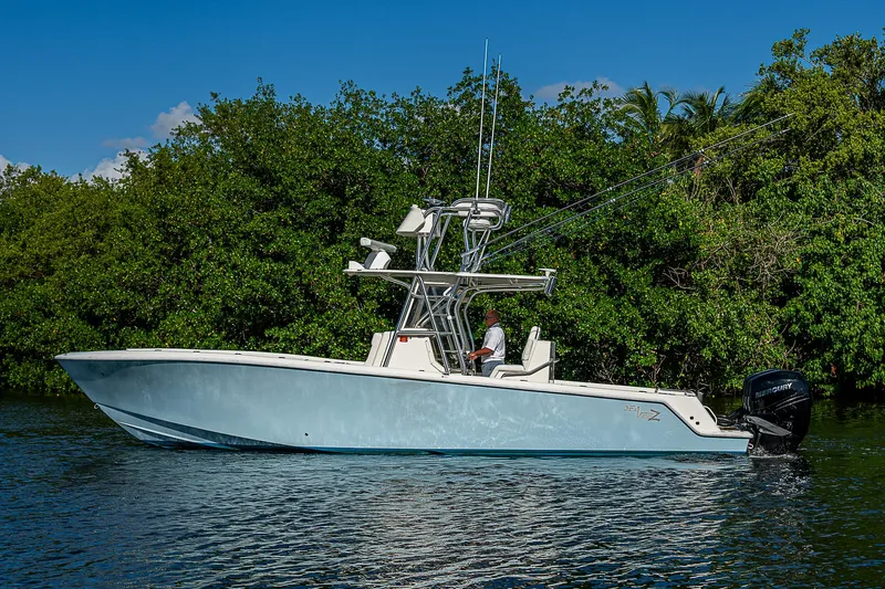  Yacht Photos Pics 2018 SeaVee 340Z boat on calm water, surrounded by lush greenery.