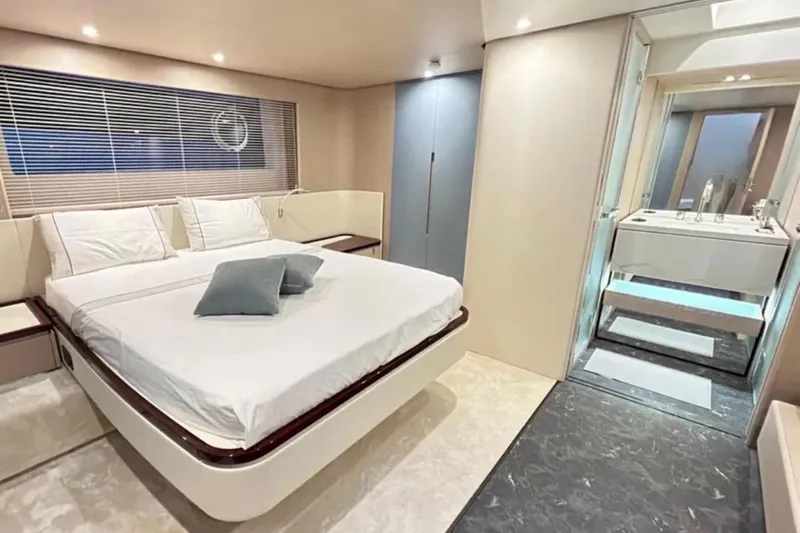  Yacht Photos Pics Luxurious bedroom interior of 2022 Azimut 68 FLY yacht with modern design and ensuite bathroom.