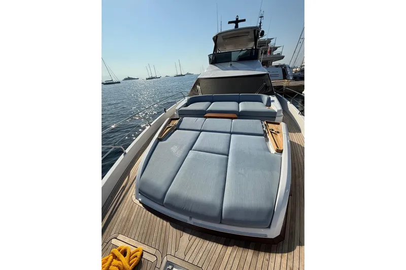  Yacht Photos Pics Azimut 68 FLY 2022 yacht with spacious sunbathing area on deck, docked at marina.