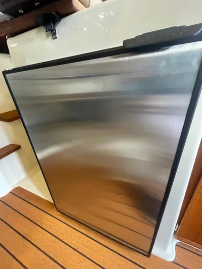 Beautiful Boat At Great Price! Yacht Photos Pics Stainless steel refrigerator on 2023 Ranger Tugs R-25 boat interior.