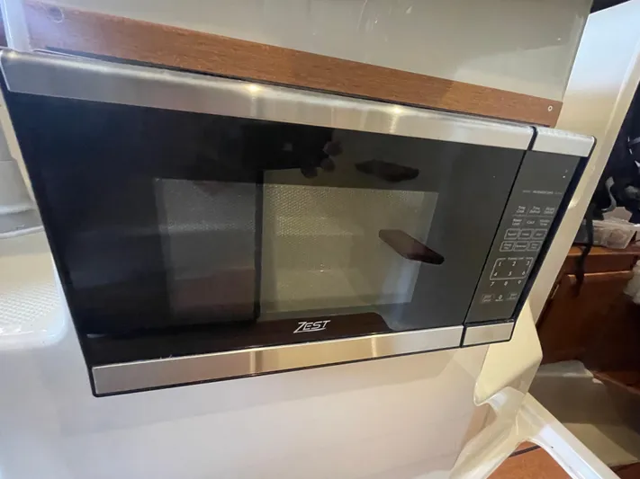 Beautiful Boat At Great Price! Yacht Photos Pics Built-in microwave in 2023 Ranger Tugs R-25 boat kitchen.