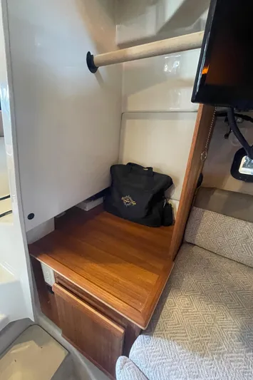 Beautiful Boat At Great Price! Yacht Photos Pics 2023 Ranger Tugs R-25 interior with wooden shelf, storage, and seating area.