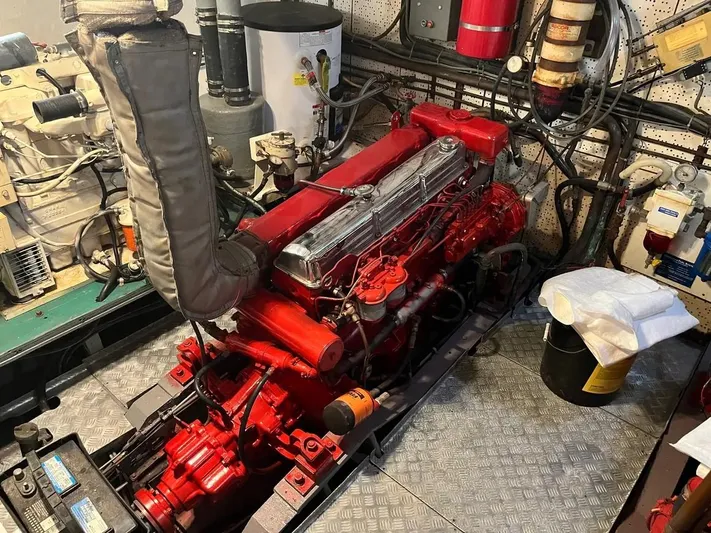 Shangri-la Yacht Photos Pics Engine room of a 1978 Cheoy Lee Ocean Access Deeded Slips boat, featuring a red engine.