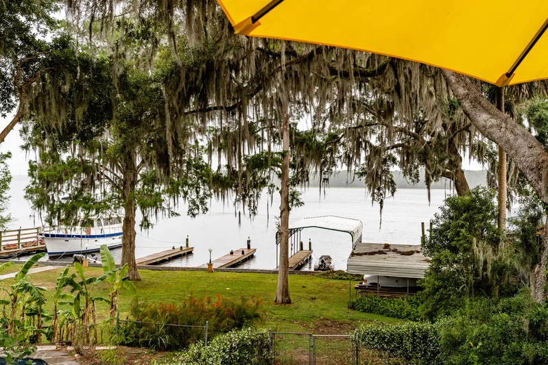 Shangri-la Yacht Photos Pics Scenic view of Cheoy Lee Ocean access deeded slips, 1978, surrounded by lush greenery and water.