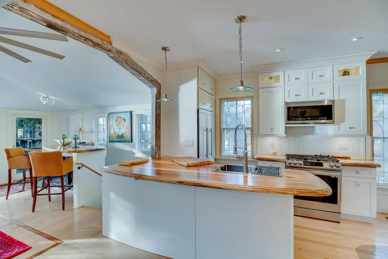 Shangri-la Yacht Photos Pics Modern kitchen with wooden countertops, stainless steel appliances, and natural light.