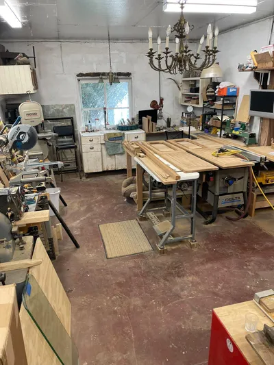 Shangri-la Yacht Photos Pics Woodworking workshop with tools, workbenches, and a chandelier; Cheoy Lee Ocean access deeded slips, 1978.