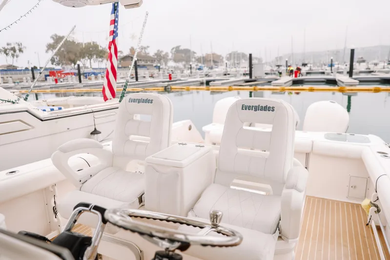  Yacht Photos Pics 2010 Everglades 350LX boat interior with white seating at marina.