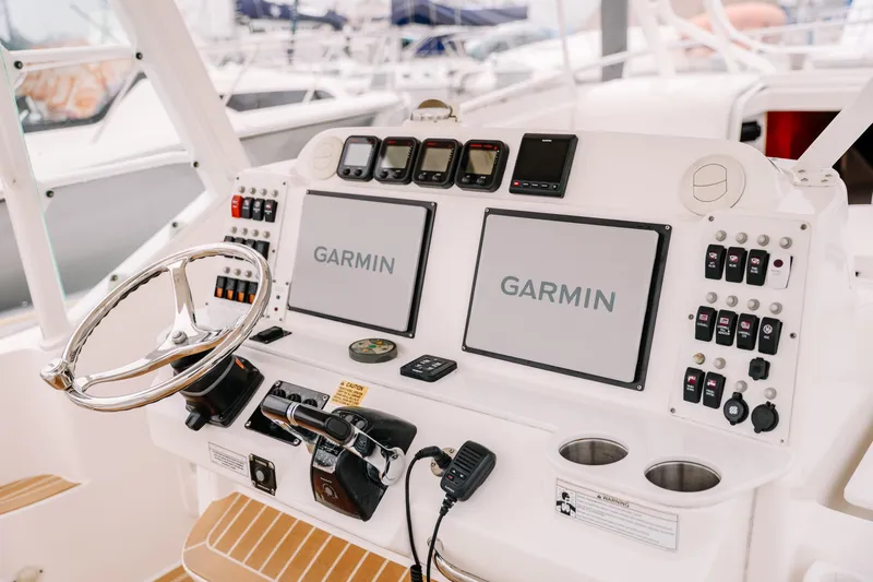  Yacht Photos Pics Control panel of 2010 Everglades 350LX boat with Garmin navigation displays.