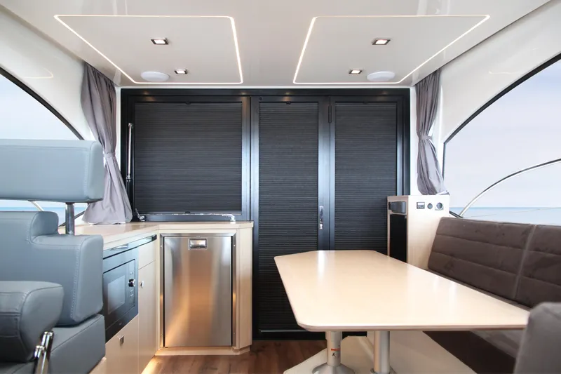  Yacht Photos Pics Luxurious interior of 2025 Skamander Monaco Coupe with modern seating and sleek design.