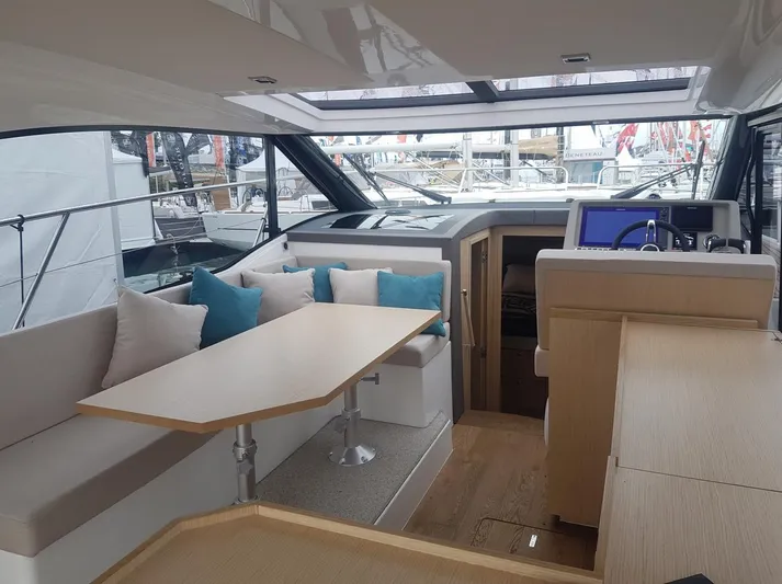  Yacht Photos Pics Interior of 2025 Skamander Monaco Coupe yacht with modern seating and navigation area.