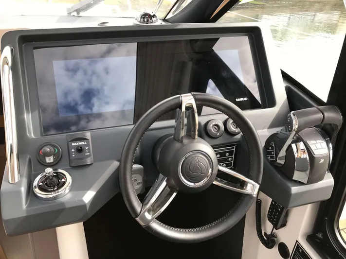  Yacht Photos Pics 2025 Skamander Monaco Coupe dashboard with steering wheel and modern controls.
