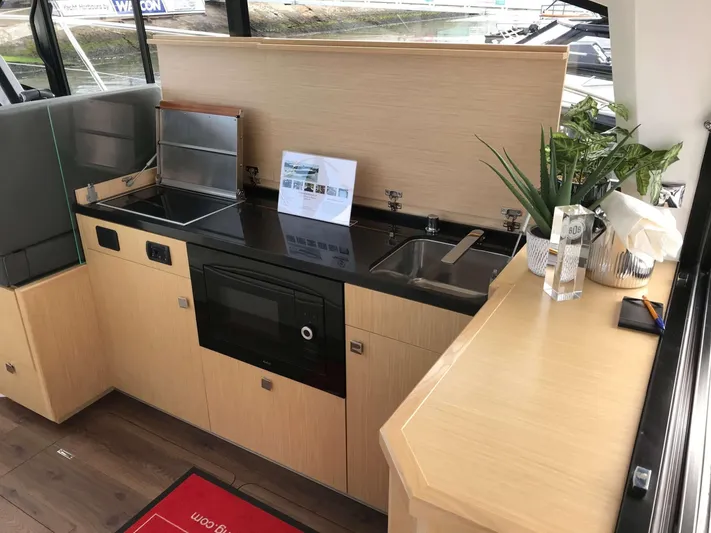  Yacht Photos Pics Modern kitchen interior in 2025 Skamander Monaco Coupe yacht, featuring sleek design and appliances.