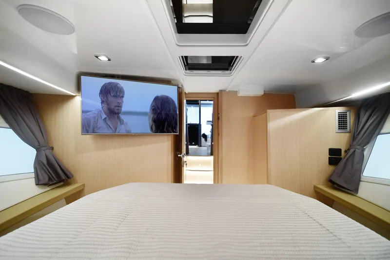  Yacht Photos Pics Interior of 2025 Skamander Monaco Coupe with TV, bed, and modern design.