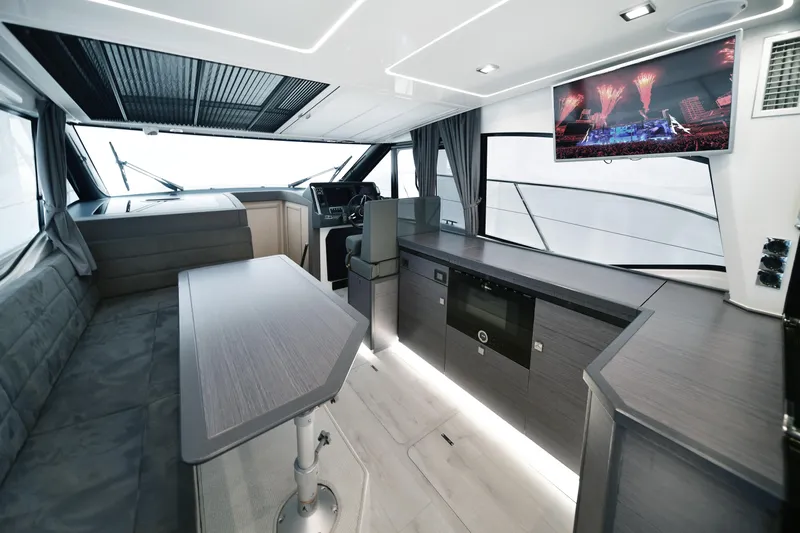  Yacht Photos Pics Luxurious interior of 2025 Skamander Monaco Coupe yacht with modern amenities and sleek design.