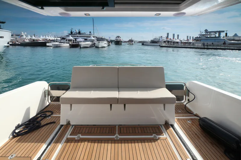  Yacht Photos Pics Luxury yacht interior with a view of a marina, featuring the 2025 Skamander Monaco Coupe.