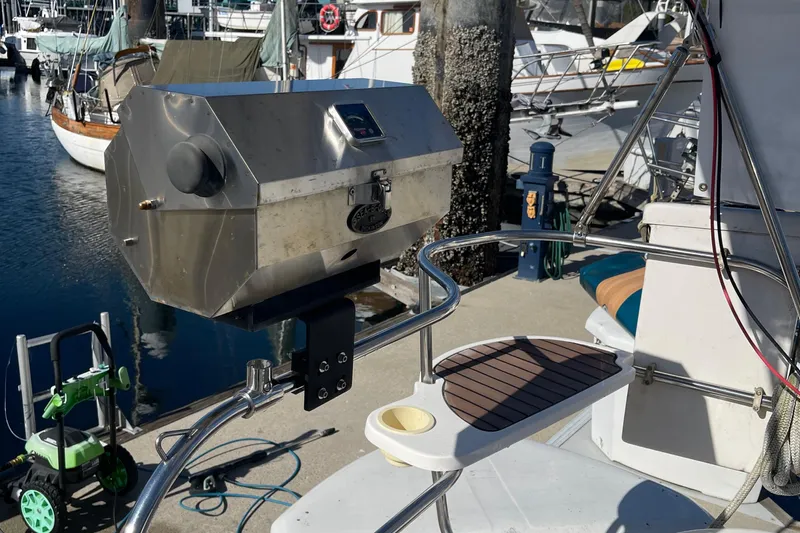  Yacht Photos Pics Stainless steel grill mounted on a 2008 Hunter 49 sailboat at a marina.