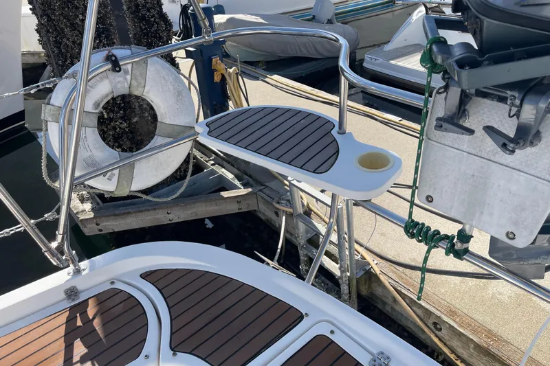  Yacht Photos Pics Hunter 49 sailboat deck, 2008 model, featuring teak flooring and safety equipment.