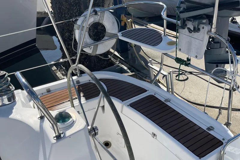  Yacht Photos Pics Cockpit of 2008 Hunter 49 sailboat with wooden deck and steering wheel.