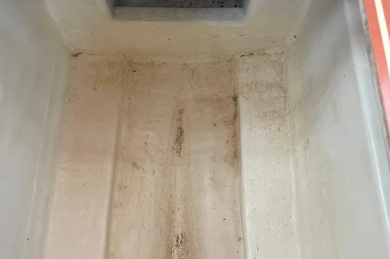  Yacht Photos Pics Interior of a 2008 Hunter 49 boat compartment, showing a clean, empty storage area.